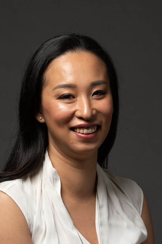 Ms Cassandra Chiu, K9Assistance Executive Director, smiling at the camera.