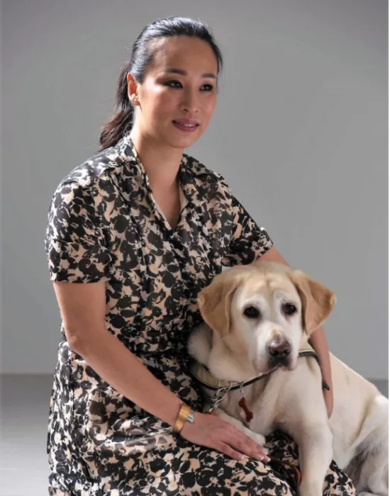 K9 Assistance Executive Director with her seeing-eye dog