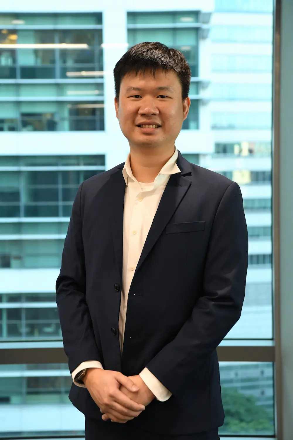 Dr Kent Soon, K9Assistance Veterinary Advisor, in a navy suit.