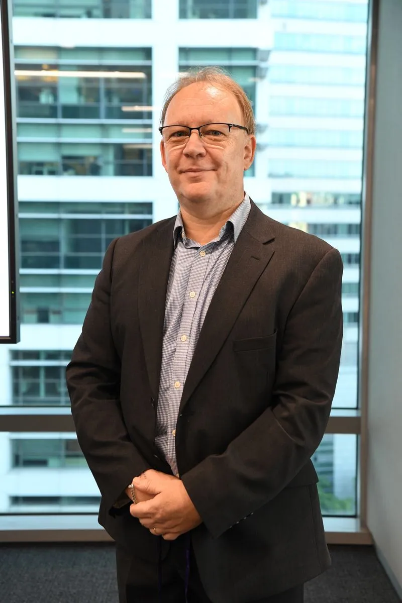 Mr Jonathan Foster, K9Assistance Vice-chairman, in a black suit.