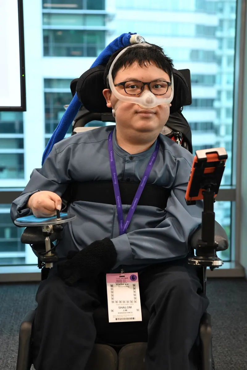Mr Shalom Lim, K9Assistance Director, in a grey shirt.
