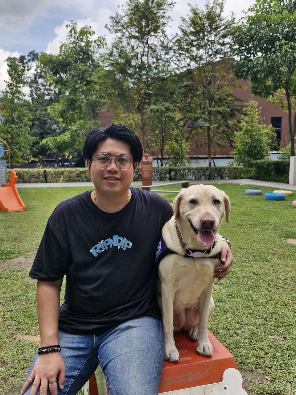 image of Marco Chia with Ambassador Assistance Dog